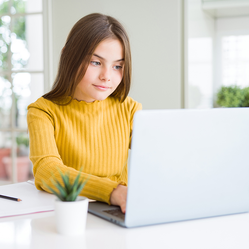Beautiful young girl studying for school using computer laptop with a confident expression on smart face thinking serious
